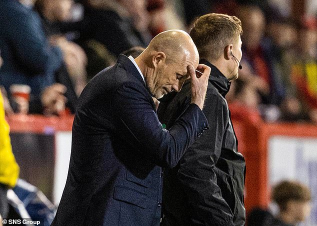 The Belgian is completely dejected as his team trails Aberdeen and Celtic by nine points