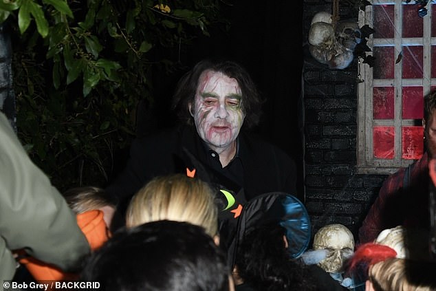 The ITV star wore white face paint and green painted eyebrows as he greeted children, along with performers dressed as Little Red Riding Hood, a wolf and a clown