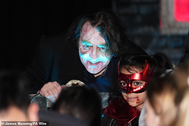 Jonathan posed for photos with children dressed in spooky costumes