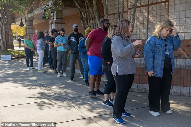 Voters wait in line to cast their ballots during early voting in Mecklenburg County, North Carolina on October 25, 2024, as reports emerged that Black voters are not turning out in the same numbers as years before.