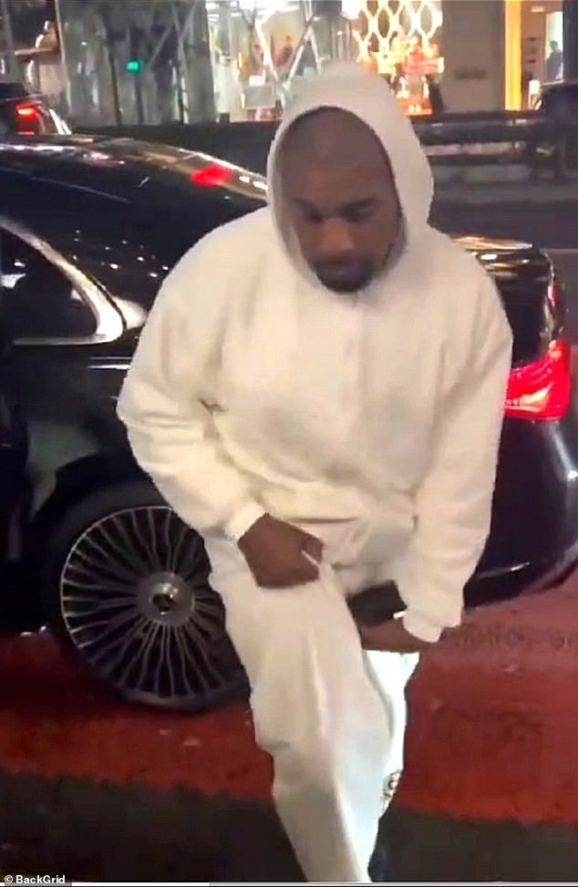 Kanye, 47, came out of their car first and stood outside waiting for Bianca, 29, as she got out of the car