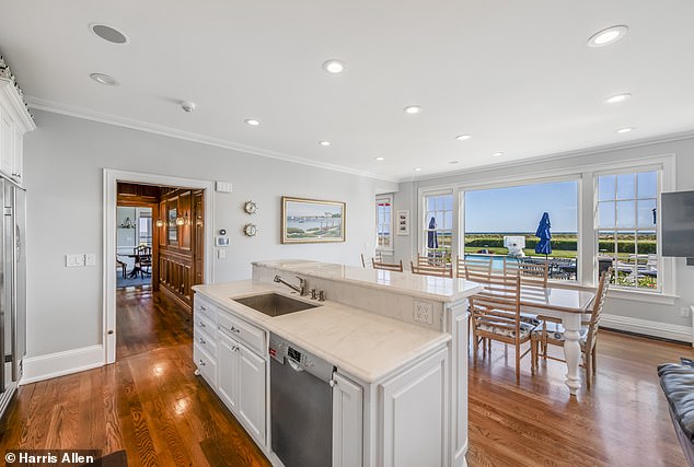 The spacious kitchen is one of 26 rooms on the enormous estate with a beautiful view of the water