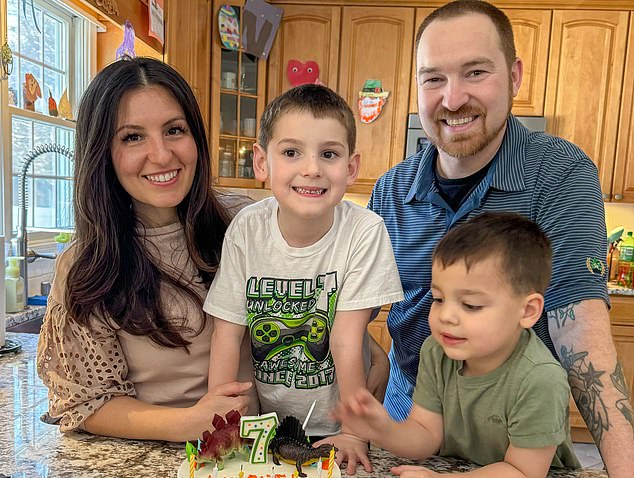 Mrs Stachelski is pictured with her family. She underwent a preventive mastectomy after learning she had the BRCA 2 gene mutation that dramatically increases the risk of breast and ovarian cancer