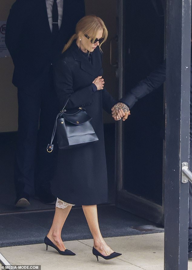 Nicole Kidman looked somber as she said goodbye to her mother Janelle in an emotional service in Sydney on Tuesday