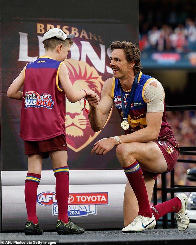 Joe Daniher (pictured receiving his premiership medal after beating the Swans in the Grand Final) has shocked football fans by retiring from football aged just 30