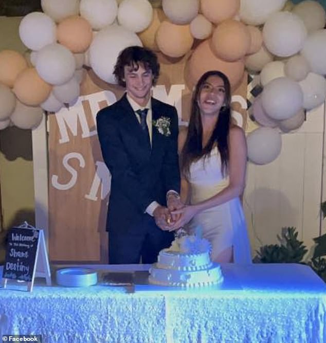 He and his wife Destiny cut their cake at their wedding