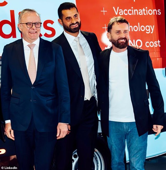 A photo on the LinkedIn page of former Qantas CEO Andrew Parker (far right) shows him at a charity event with the Prime Minister