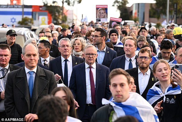 Anthony Albanese is pictured center on Monday at an Oct. 7 event in Melbourne