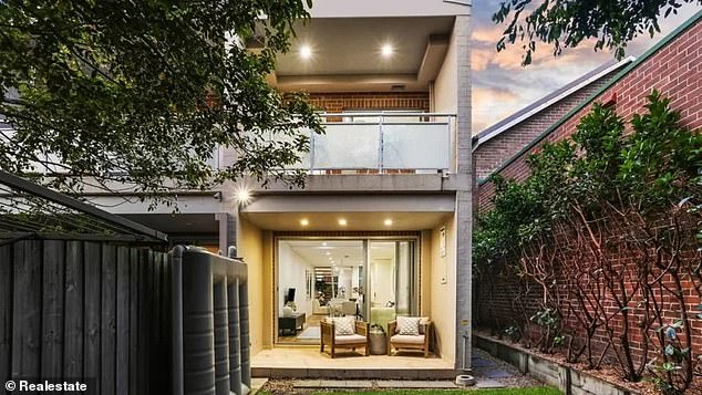 The three-bedroom townhouse at 29B Lewisham St in Dulwich Hill (pictured) was due to go under the hammer at 11am on October 12 with a guide of $1.9 million