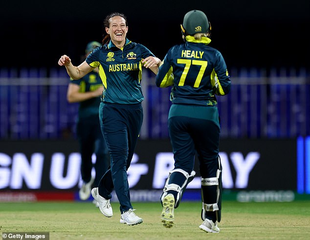 Aussie Megan Schutt (left) celebrates one of her wickets as she took a whopping three scalps for just three runs against New Zealand