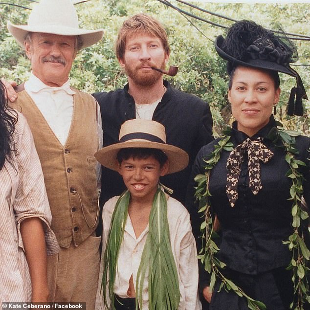 Taking to Facebook, the Brave hitmaker shared a photo of herself posing alongside Kris and co-star David Wenham on set for the 1999 film Molokai.