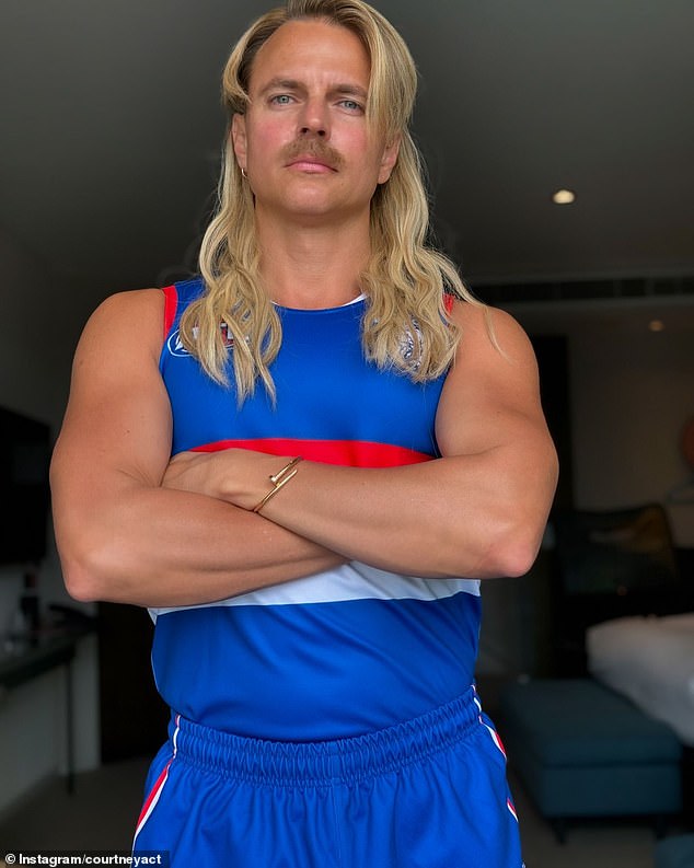 Courtney Act (pictured) looked unrecognizable as she transformed into AFL star Bailey Smith for Halloween this weekend