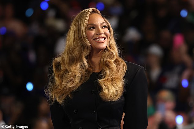 Beyoncé smiles at the crowd as she takes the stage at Kamala Harris' event in Houston