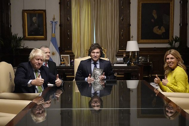 Thumbs up for freedom: Boris and his wife Carrie with Argentina's radical president Javier Milei