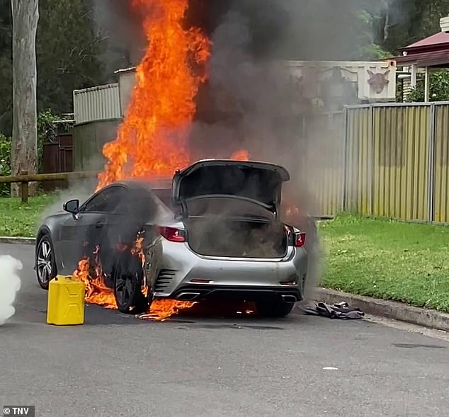 A silver sedan has gone up in flames just minutes after as many as 10 bullets were fired at a house in Sydney's western suburbs on Wednesday afternoon (pictured)