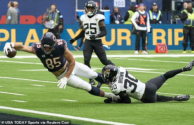 Cole Kmet dives for his first touchdown of the day in the Bears' win over the Jags in London