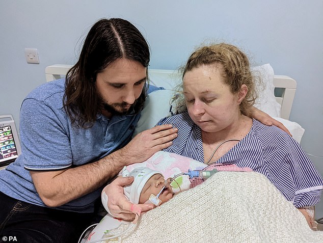 Robert Miller and Katie Fowler with their daughter Abigail Fowler Miller, who died two days after birth at the Royal Sussex County Hospital (RSCH) in Brighton in January 2022. An inquest concluded she would probably have survived if her mother had received medical treatment earlier