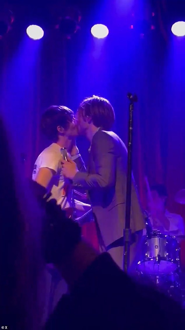 Finneas (R) surprised his fans by kissing his male guitarist Ricky Gourmet aka 'Rat' (L) during his show at Warsaw Concerts in Brooklyn on Saturday evening