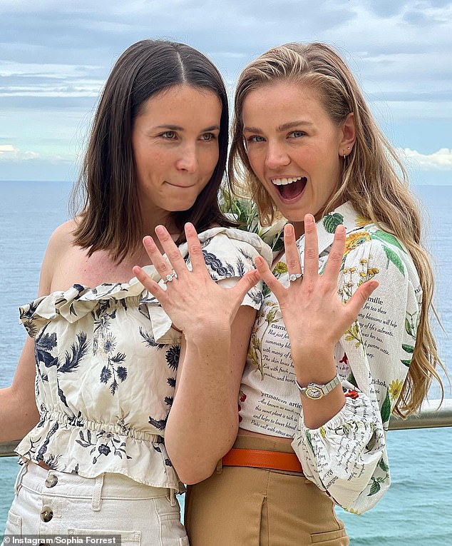 Billionaire Andrew 'Twiggy' Forrest's daughter Sophia has tied the knot with her lover Zara Zoe. Pictured: Zoe (L) and Sophia (R) showing off their rings after their 2022 engagement