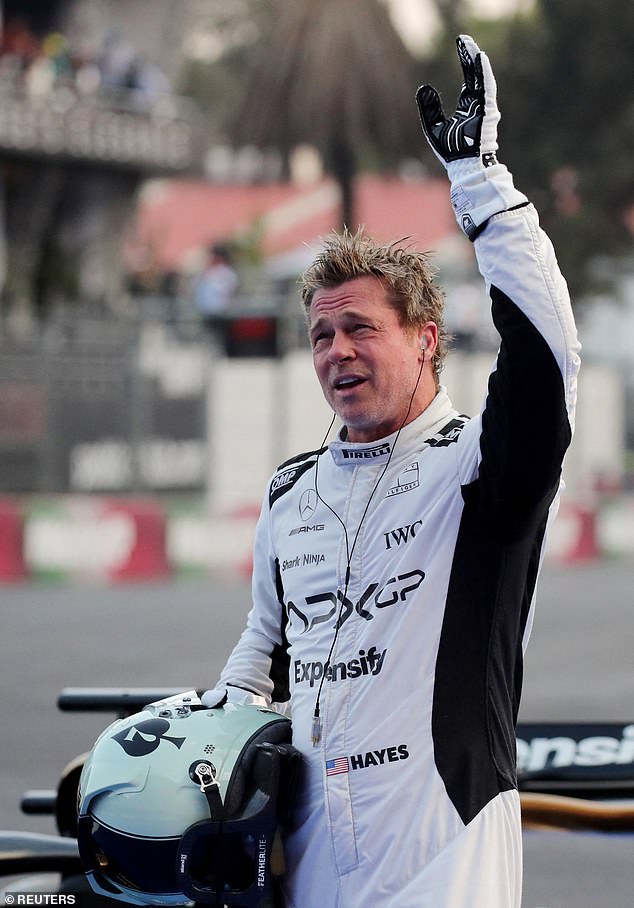 The 60-year-old actor wore a white racer jumpsuit while filming scenes for his upcoming movie F1