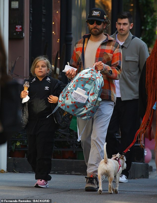 Bradley Cooper looked every bit the doting dad as she spent quality time with his daughter Lea in New York City this week