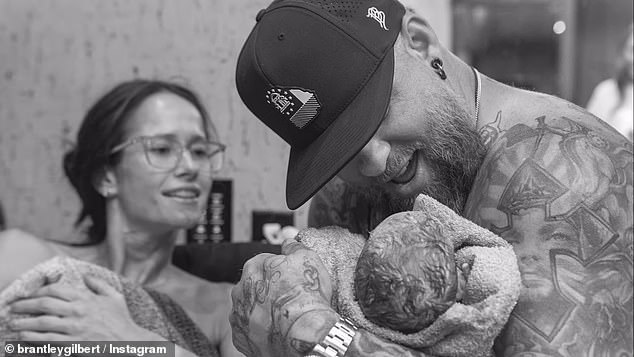 Country singer Brantley Gilbert and his wife Amber Cochran Gilbert welcomed their third child together, a son, on Friday evening, October 11, after she went into labor during his show.