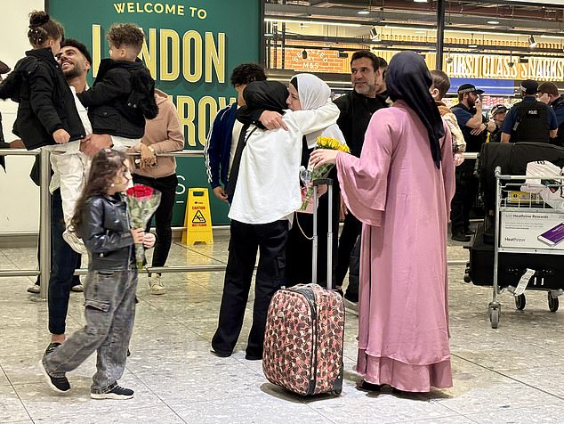 Other emotional families were seen hugging their loved ones as they returned to Britain