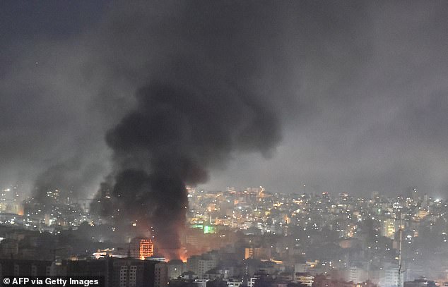 Smoke rises from the site of an Israeli airstrike that targeted a neighborhood in Beirut's southern suburbs early on October 3, 2024