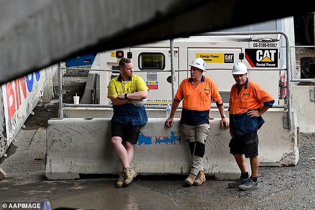 The construction worker claimed his Australian colleagues were too preoccupied with counterfeit drinks to work after 3pm every day (pictured, Sydney tradies)