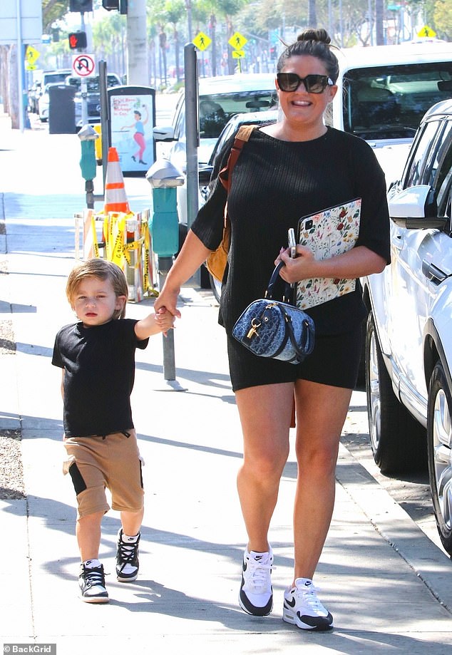 She had a big smile on her face and was a loving mother as she kept a close eye on her child. The reality TV personality even coordinated outfits with her son as they both dressed in matching, black T-shirts