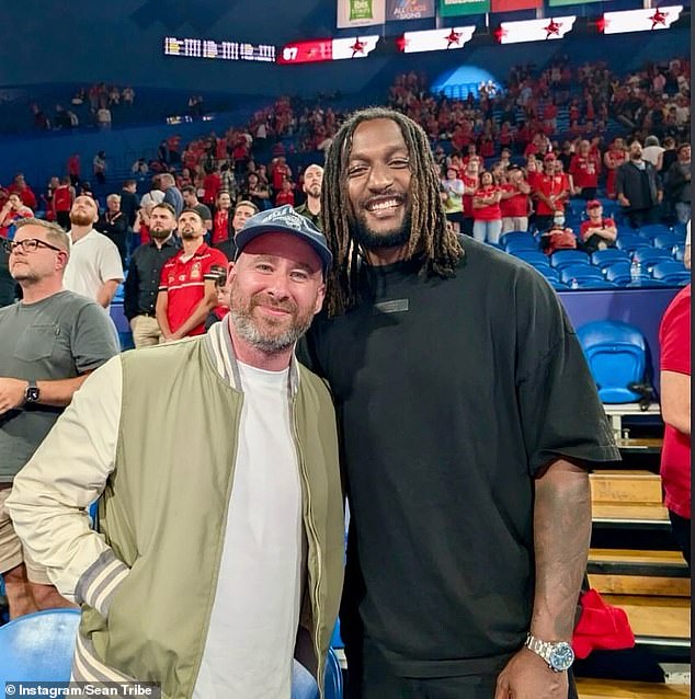 Sean Tribe (pictured left) rubbed the shoulders of former West Coast Eagles AFL player Nic Naitanui during a Perth Wildcats match