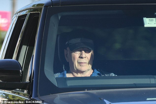 Bruce Willis was spotted sitting in the passenger seat of his car as he was taken for a drive through sunny Los Angeles this week amid his battle with dementia