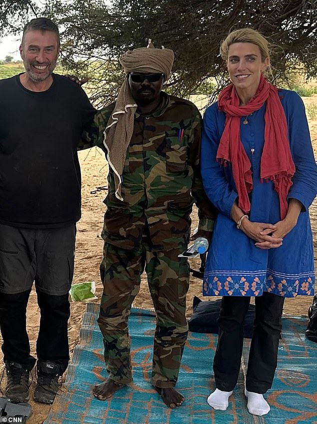 CNN's Clarissa Ward has revealed that she and her team were held captive by a militia for two days while reporting in Darfur. She is pictured laughing awkwardly with her cameraman Scott McWhinnie and one of their captors after being told they would be released.