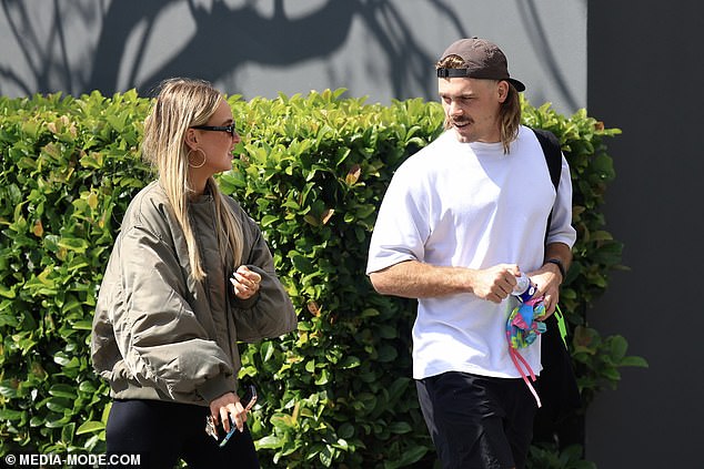 The pair seemed delighted to be in each other's company and smiled as they walked down the leafy street in Sydney