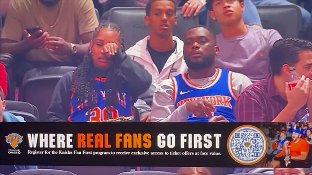 A man sitting behind the two Knicks fans was noticeably eavesdropping as the woman became irritated, turned her head away from her acquaintance and wiped a tear from her eye.