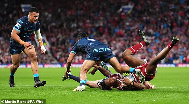 Peta Hiku (second from left) faces a long-term ban after being referred to the tribunal for touching the shoulder of Wigan's Junior Nsemba (with ball) after being injured in a big hit