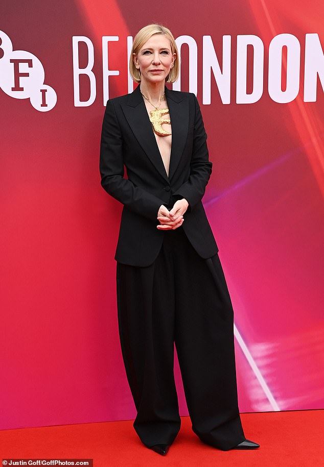 Cate Blanchett wowed in a plunging black suit as she attended the premiere of their new thriller series with Sacha Baron Cohen on Thursday