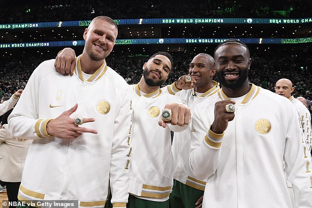 Celtics stars (from left) Porzingis, Tatum, Horford and Brown show off their new jewelry