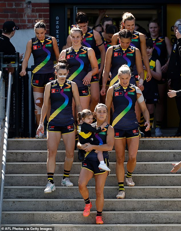 Dempsey is pictured with her daughter Pippa ahead of her 50th match this season