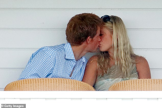 Prince Harry kisses Chelsy Davy in the Royal Box during a match at the Guards Polo Club in July 2006