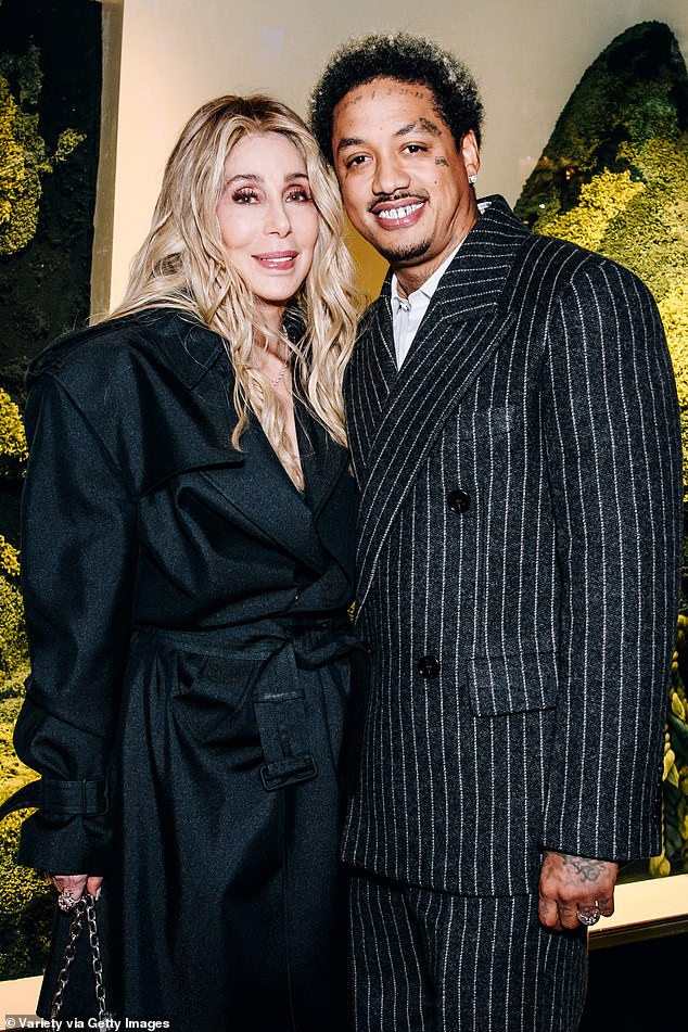 Cher put on a very cozy performance with her boyfriend Alexander 'AE' Edwards as they attended the reopening of Burberry's newly renovated New York flagship store in Midtown Manhattan on Wednesday