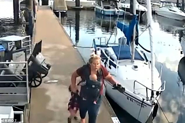 Surveillance footage shows the moment a mother quickly walked down the dock with her children in tow before fleeing when an otter chased them around 9:30 a.m. at Bremerton Marina on September 12.