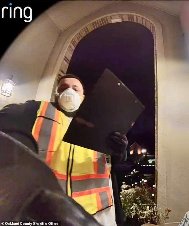 A man wearing a long white T-shirt, face mask and reflective yellow vest was captured on Ring CCTV at the couple's home telling them: 'We are DTE. We check for gas leaks before showing a clipboard with a piece of paper on it