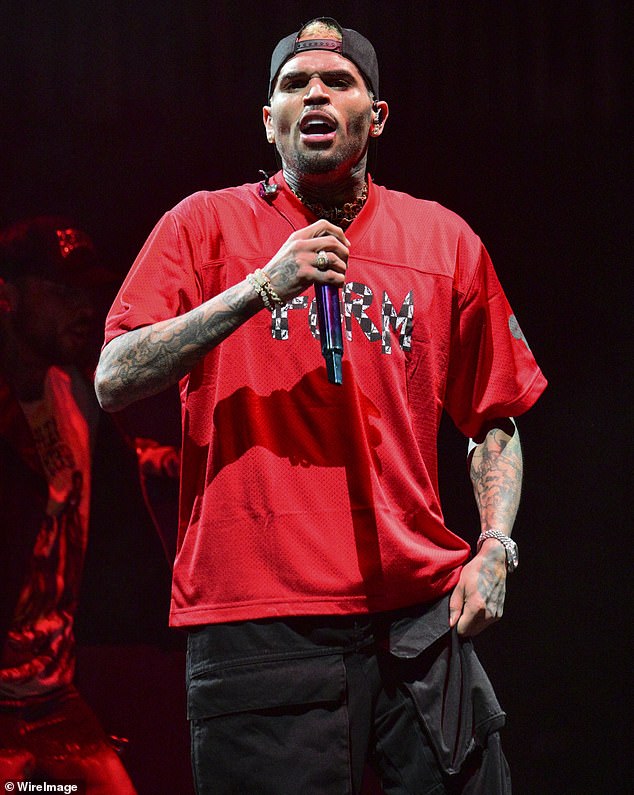 Chris Brown's 35-year-old accuser has alleged that the singer drugged and raped her during a yacht party outside Sean 'Diddy' Combs' Miami mansion; seen in February in Atlanta