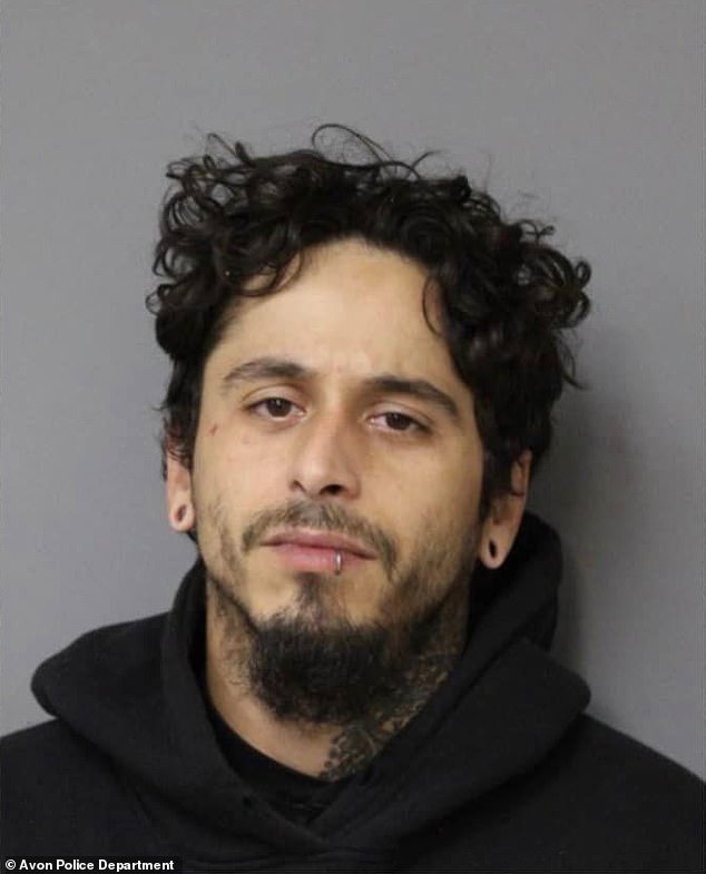 Alex Joel Rivera, 29, was arrested after he allegedly hit a teenage cyclist and fled the scene while the victim remained on the roof of his car, according to police