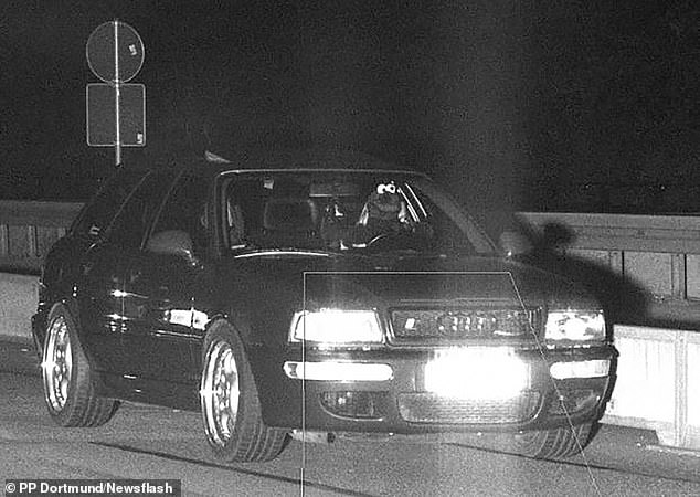 The bizarre photo - taken by a mobile roadside dispatcher in Dortmund, West Germany - shows a driver driving at 100 km/h in a 50 zone while dressed as Cookie Monster.