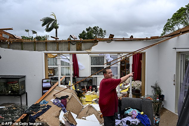 (Above) Robert Haight looks around his destroyed home after it was hit by a reported tornado in Fort Myers, Florida on October 9, 2024