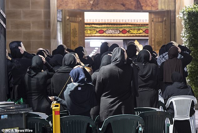 Dozens of women mourned outside a Sydney mosque on Tuesday evening (pictured) after the women's wing signed up for a prayer session in honor of Hezbollah leader Hassan Nasrallah