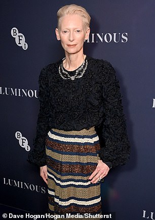 Oscar winner Tilda was equally stylish in a black ruffled top which she wore with a statement striped maxi skirt