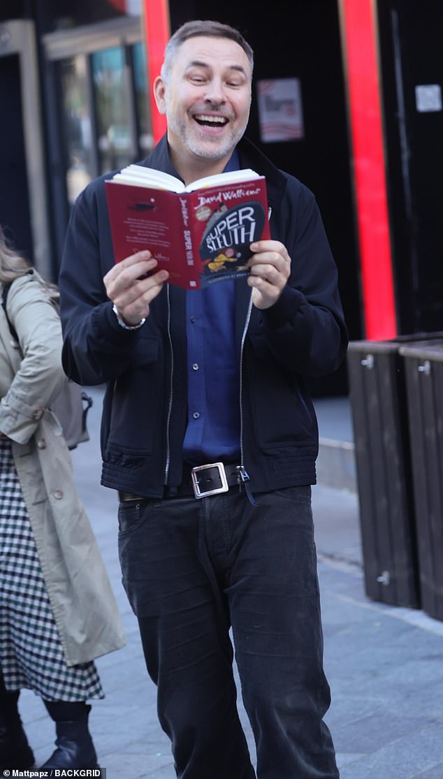 David Walliams puts on an animated show as he posed for some fun photos after visiting Heart Radio on Thursday